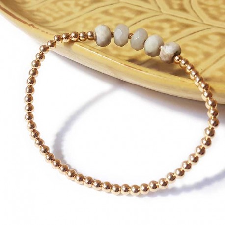 Bracelet with golden beads and faceted white jasper