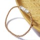 Bracelet à perles dorées et howlite facettée