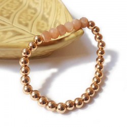 Bracelet with thick golden beads and faceted sunstone