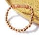 Bracelet with thick golden beads and faceted sunstone