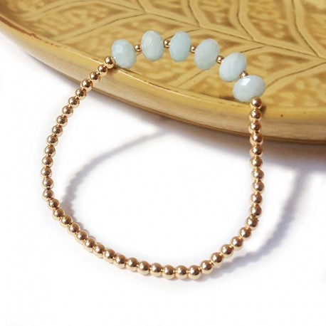 Bracelet with gold beads and faceted aquamarine